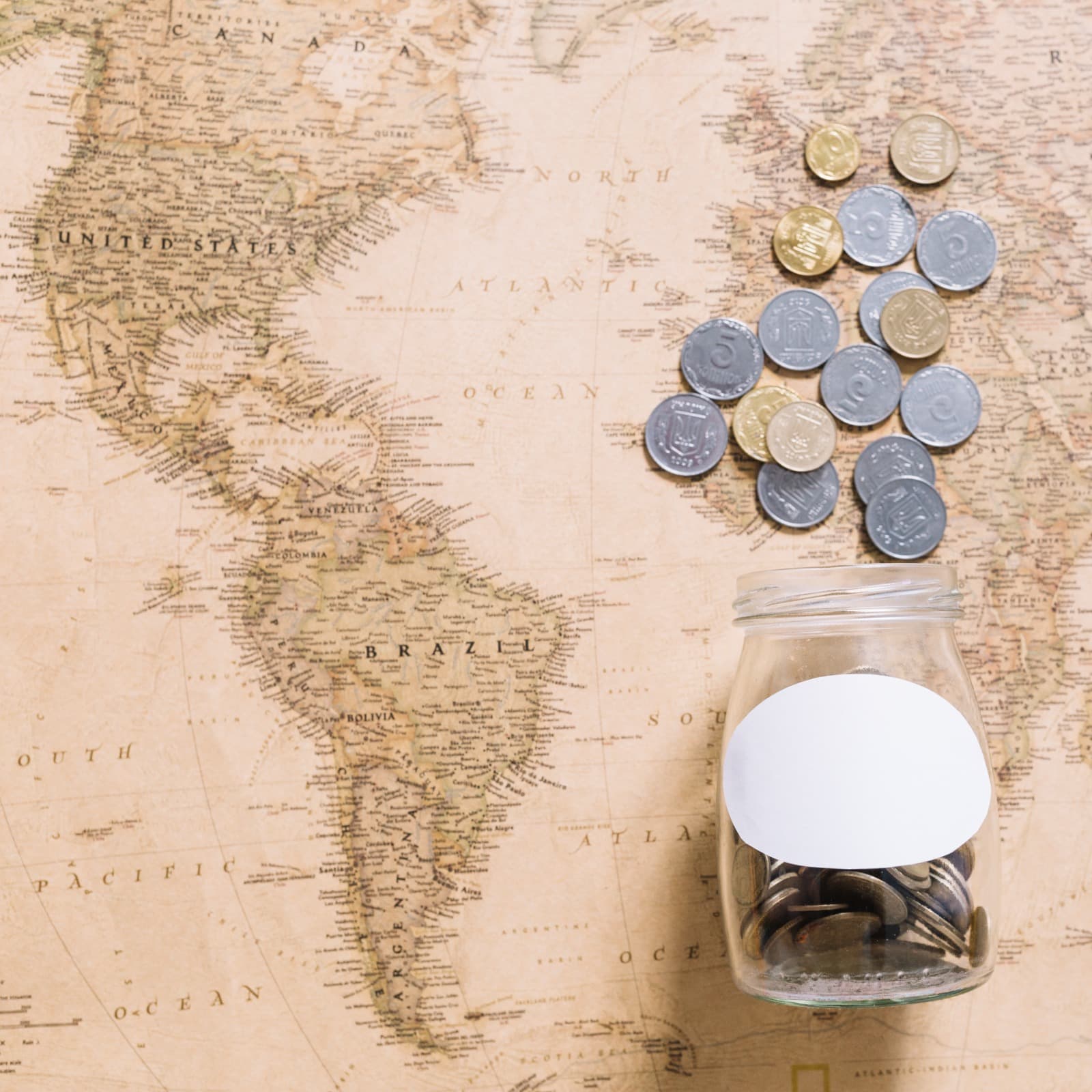 World map with a coin jar — representing global investment research and international market access